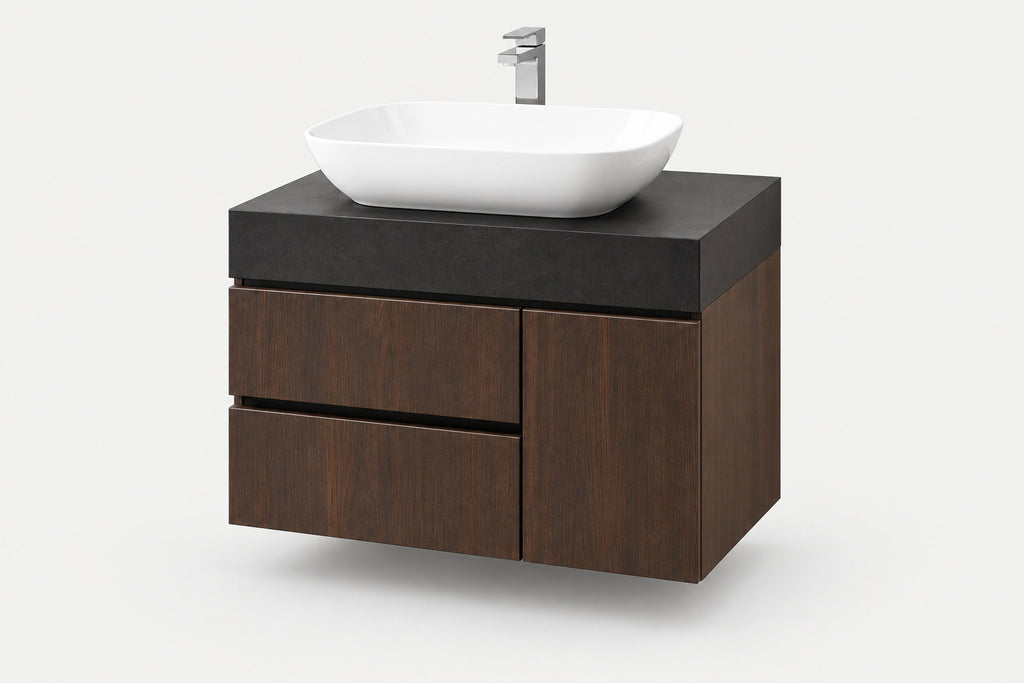 A modern floating bathroom vanity with a dark wood cabinet, a matte black countertop, a white vessel sink, and a chrome faucet, shown on a light gray background.