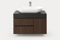 A modern floating bathroom vanity with a dark wood cabinet, a matte black top, and a white oval vessel sink with a chrome faucet, shown against a light gray background.