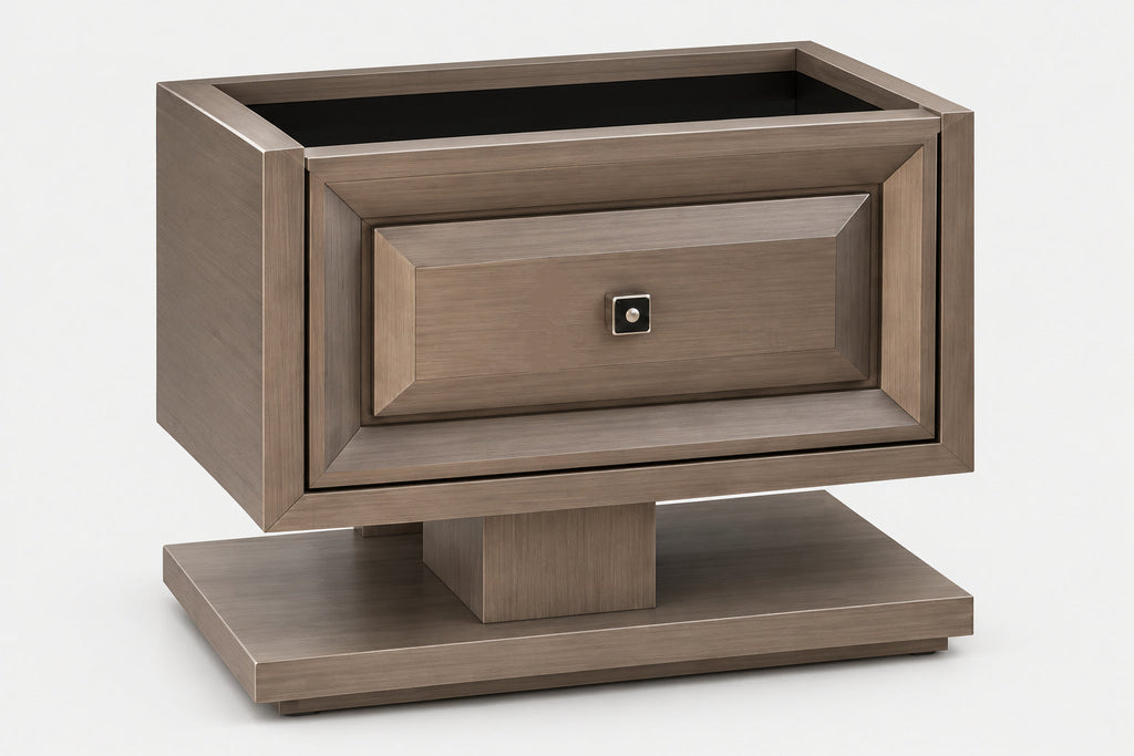 A modern wooden nightstand with a single drawer, featuring a geometric tiered base and a small square metal pull handle, shown on a light gray background.