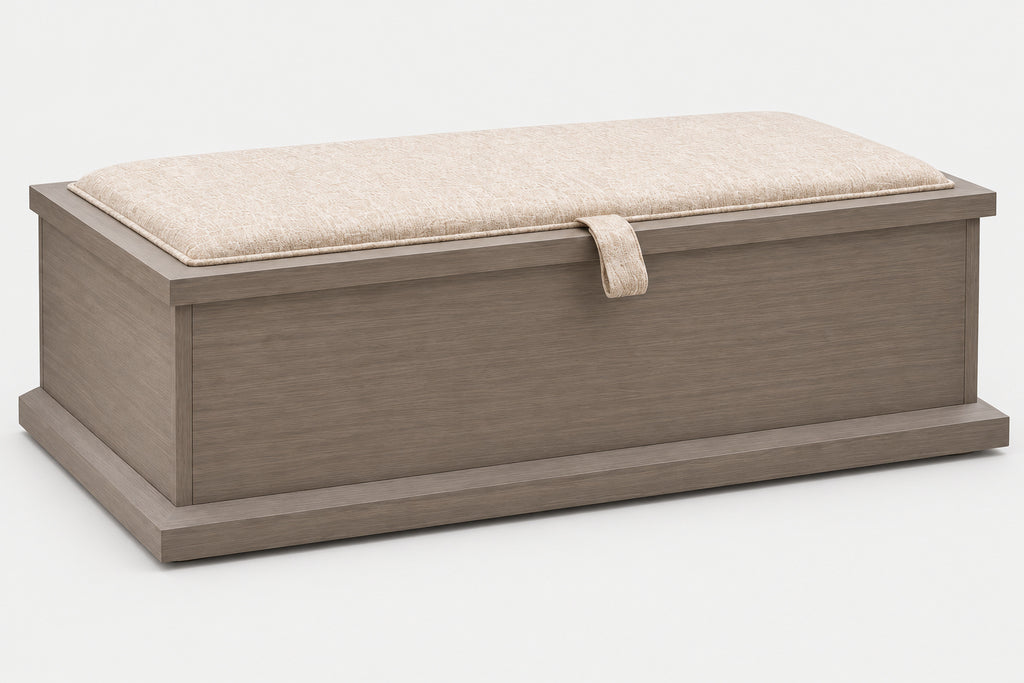A rectangular storage bench with a gray-brown wood-grain frame and a light beige textured cushion on top, featuring a small matching fabric pull tab on the front.