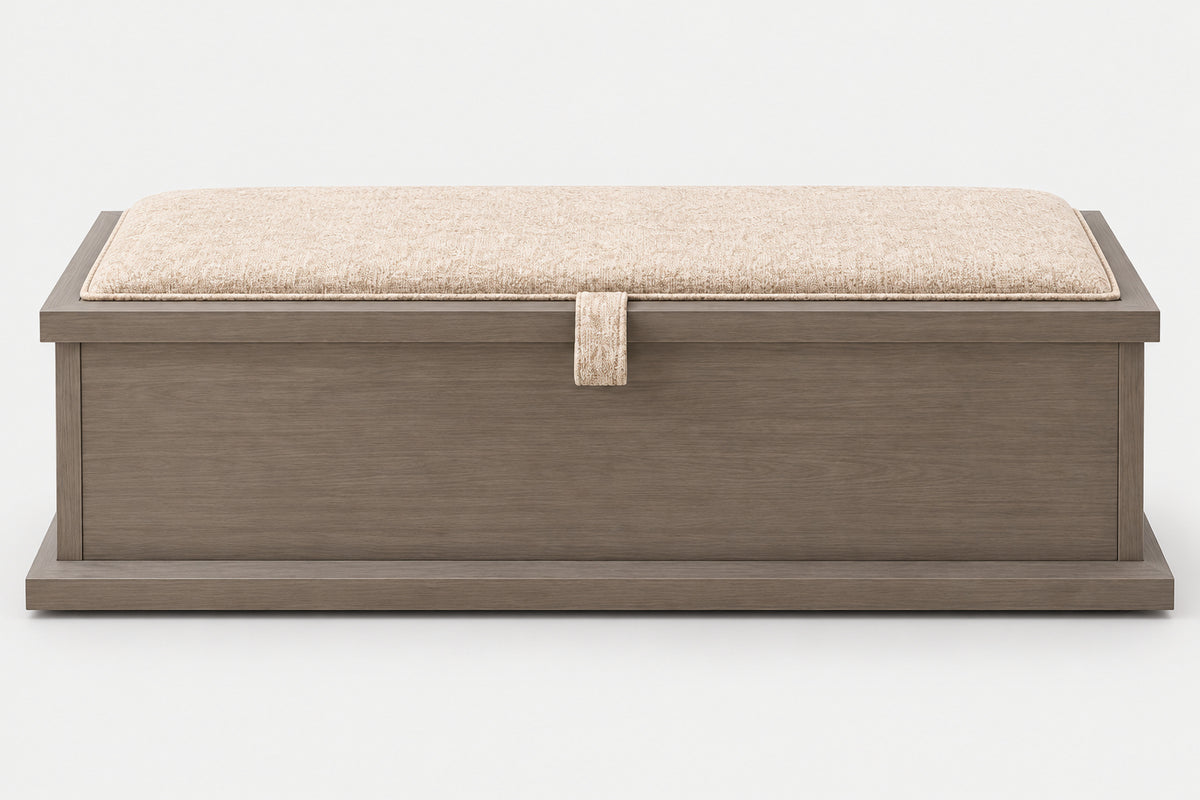 A rectangular storage bench with a medium brown wood-grain finish and a beige textured fabric cushion on top, featuring a small matching fabric pull tab on the front.