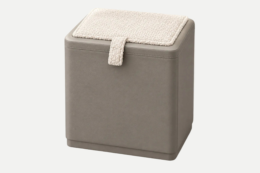 A square storage ottoman with a taupe-brown faux leather exterior and a cream sherpa-lined lid, shown on a clean white background.