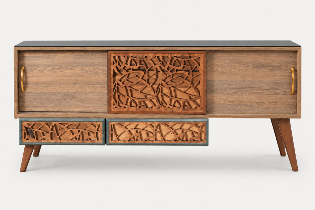 Mid-century modern wooden sideboard with carved leaf-pattern doors and drawers, a dark top surface, and angled legs, shown on a light gray background.