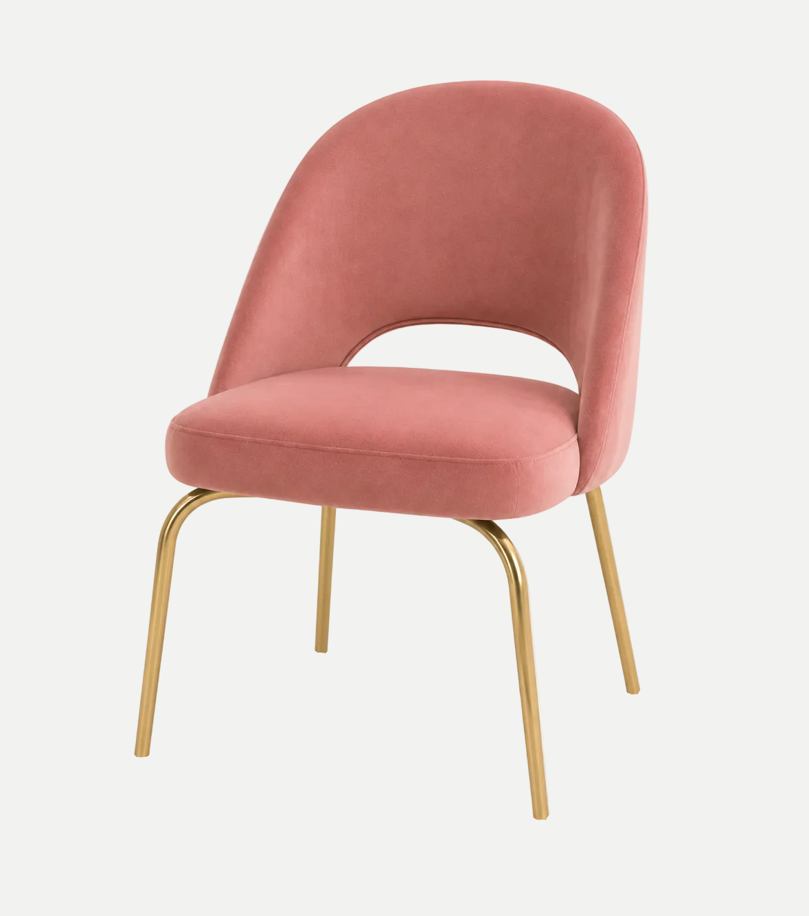A modern accent chair with a rose pink velvet upholstered seat and curved backrest, supported by slim gold-finished metal legs, shown on a solid white background.