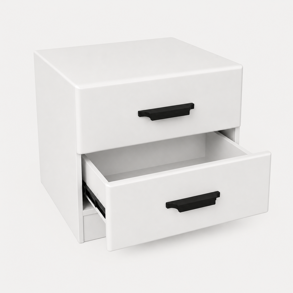 A white two-drawer nightstand or storage cabinet with black drawer pulls, shown on a clean light gray studio background. The lower drawer is slightly open, revealing the interior.