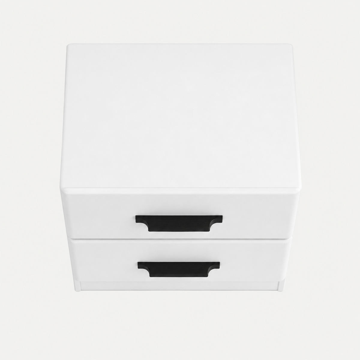 A small white two-drawer nightstand or storage cabinet with black pull handles, photographed on a clean light gray background.