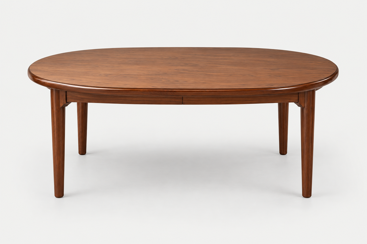 An oval wooden dining table with a warm medium-brown finish and four tapered legs, shown on a clean white background.