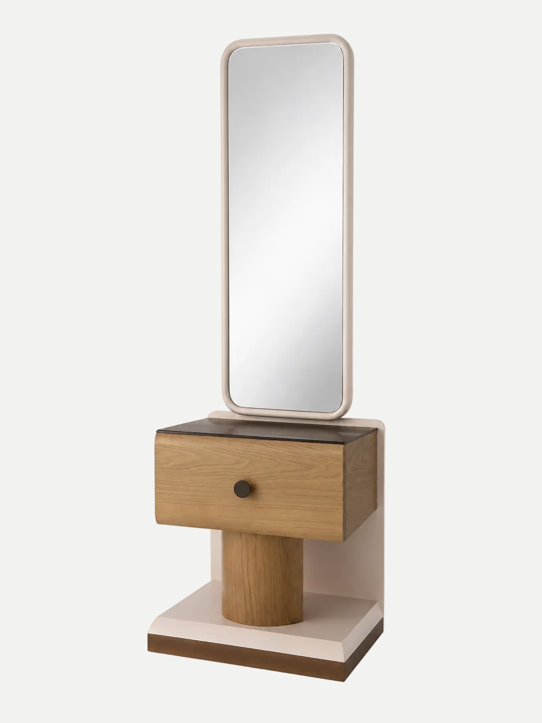 A modern vanity table with an integrated rectangular mirror, featuring a light oak wood drawer with a single dark metal knob, a cylindrical wood pedestal, and a cream-colored base, set against a plain light gray background.
