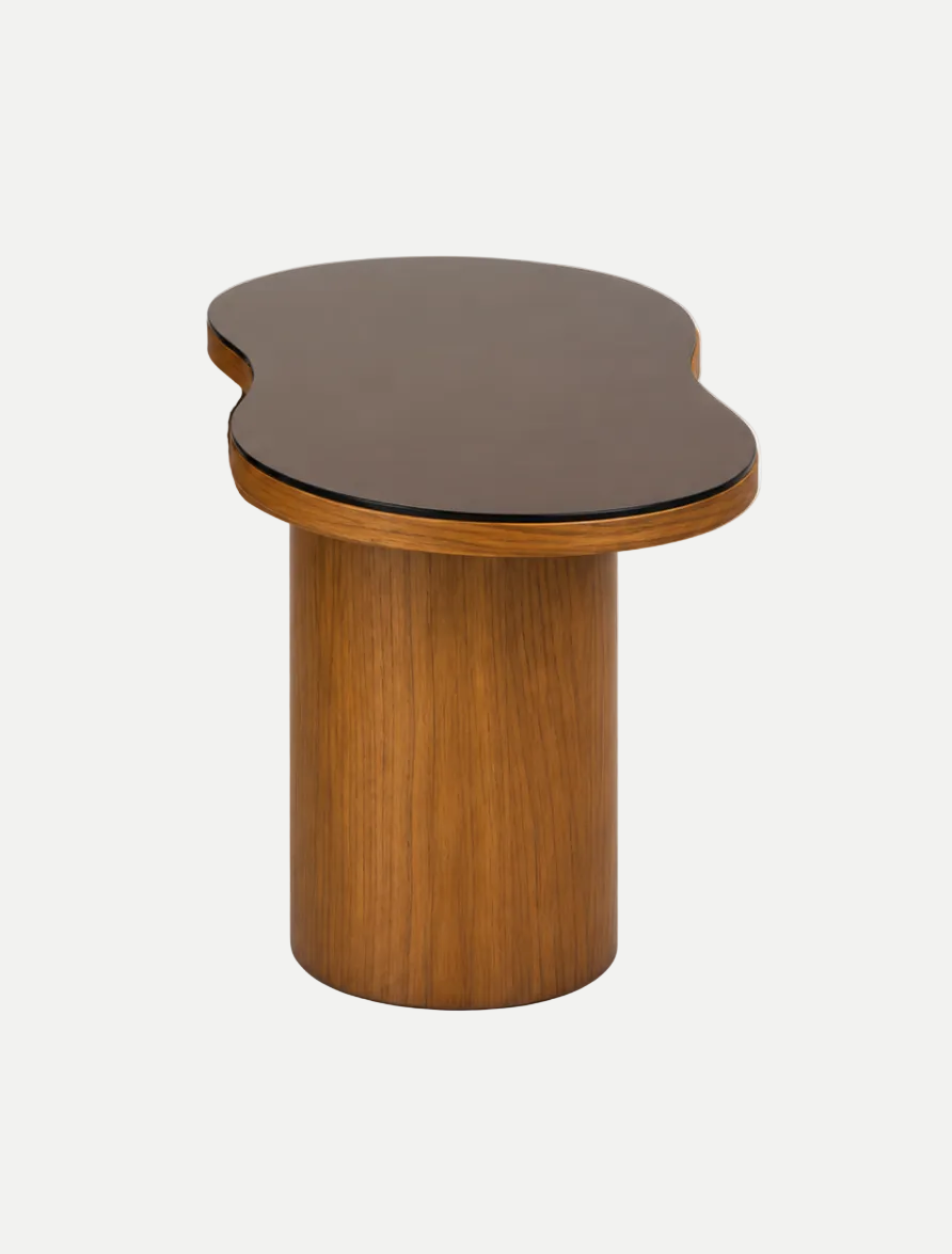 A modern wooden side table with a cylindrical base and an organic, asymmetrical top, shown on a clean white background.