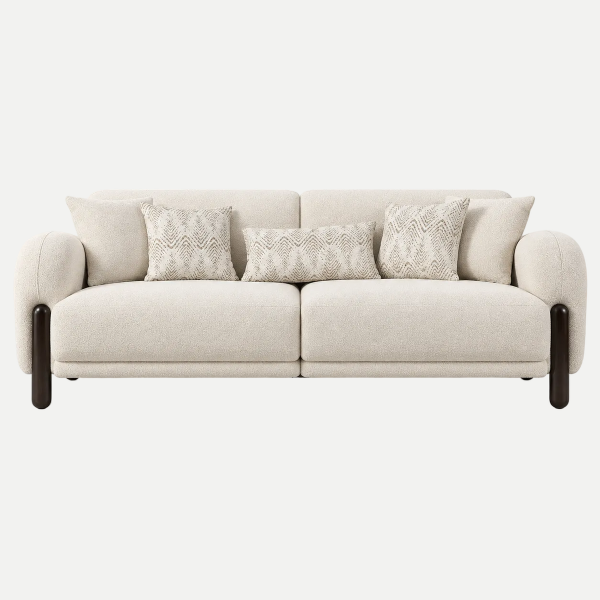 A modern two-seater sofa upholstered in a light beige textured fabric, featuring dark brown cylindrical legs and four decorative throw pillows, shown against a plain light gray background.