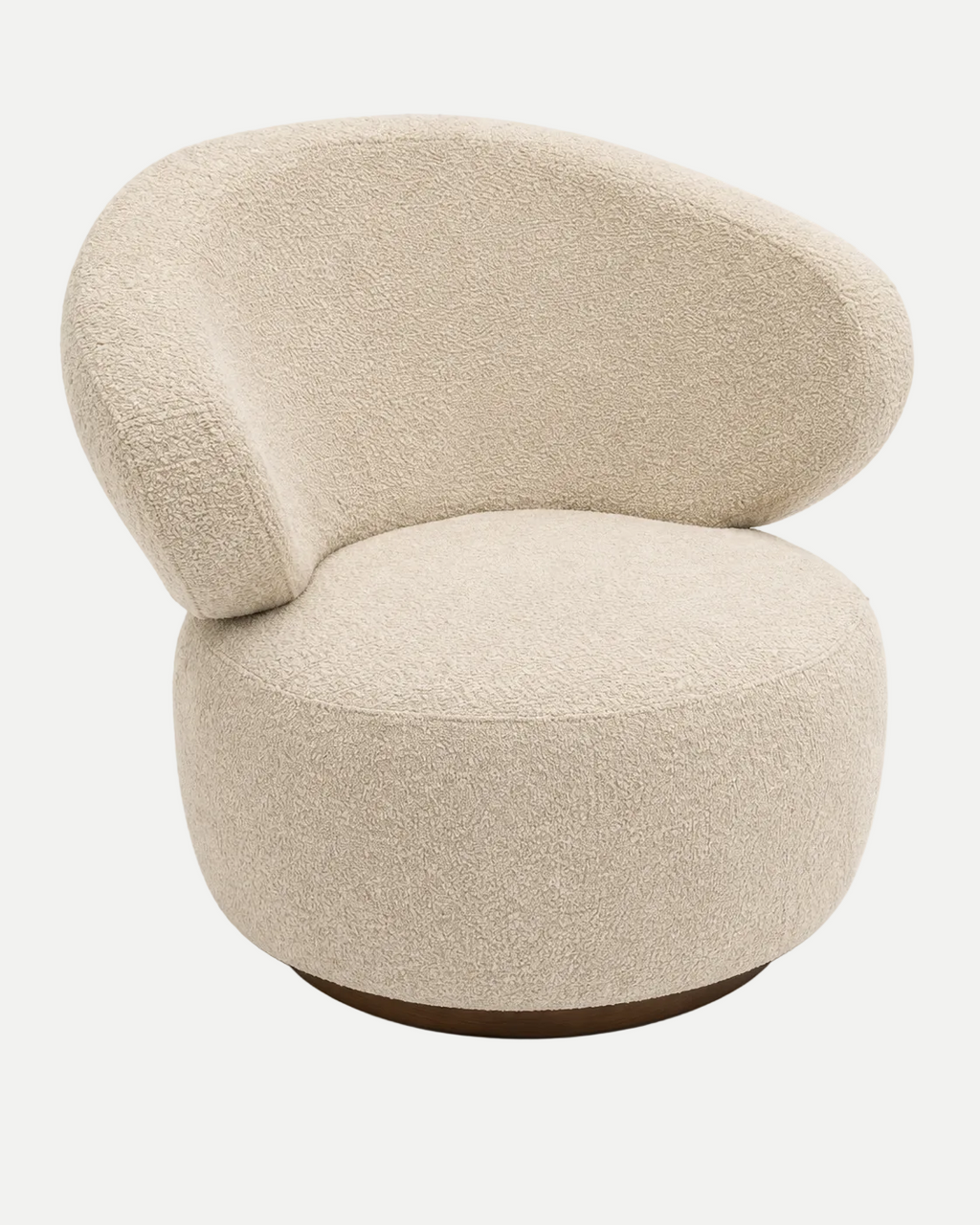 A modern, rounded boucle armchair in a warm cream or beige fabric, featuring a low, wide backrest and a circular base with a dark wood-look foot, shown on a plain white background.