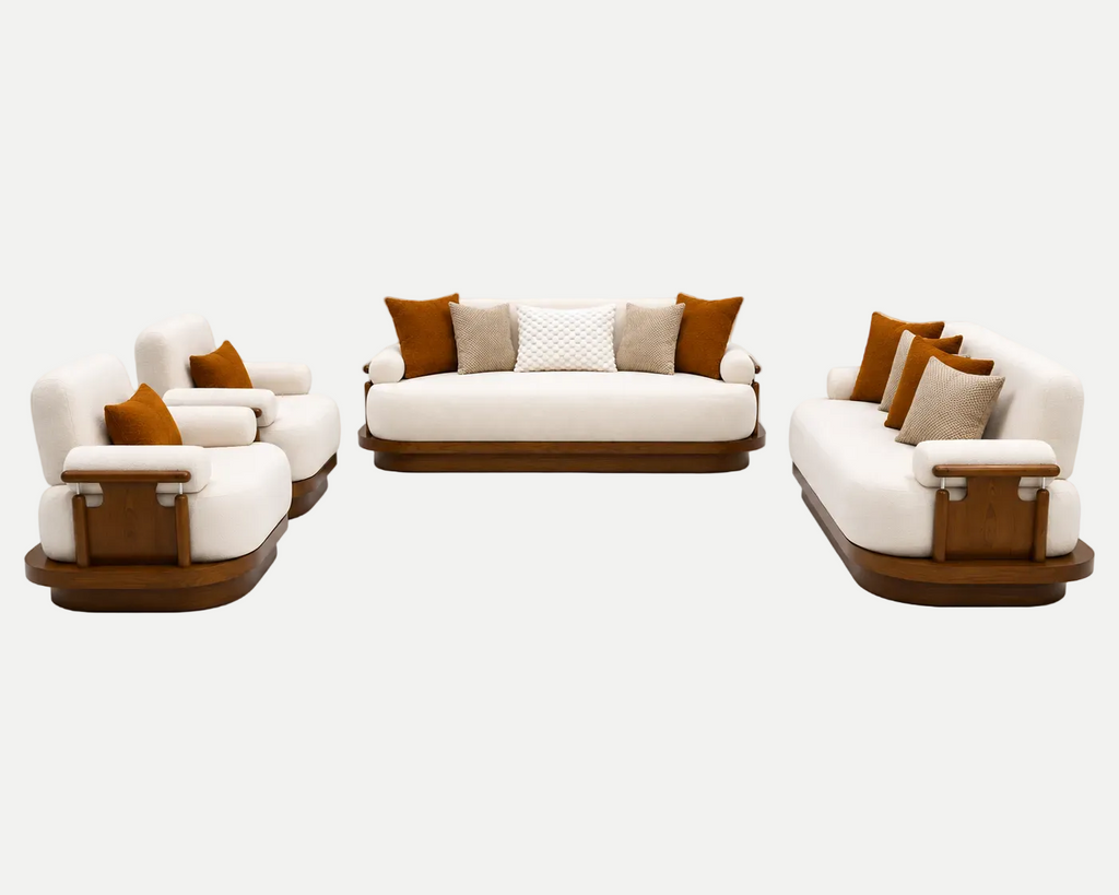 A modern 3-piece sofa set featuring cream-colored upholstery, warm brown wooden bases, and accent pillows in brown and beige, set against a seamless light gray background.