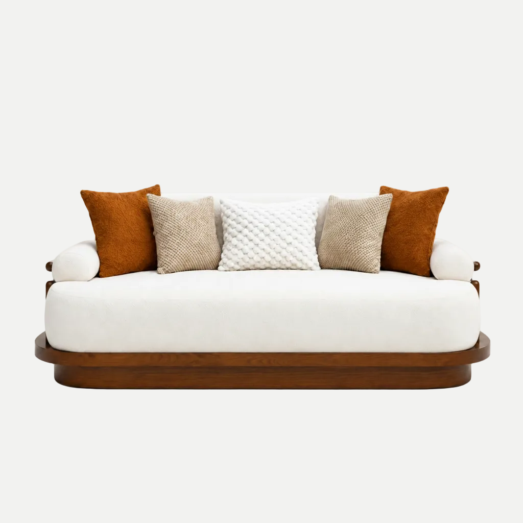 A modern sofa with a white upholstered cushion, a dark brown wooden base, and five decorative throw pillows in rust orange, beige, and white textured patterns, set against a plain white background.