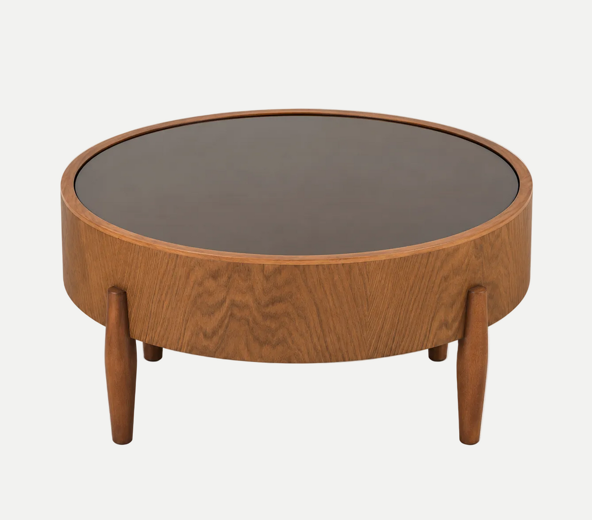 A round wooden coffee table with a medium brown wood grain finish, featuring a dark brown circular top and four tapered legs, shown on a light gray background.