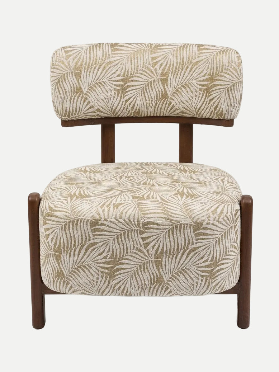 A modern accent chair with a beige and white palm leaf patterned upholstery and a dark brown wooden frame, shown against a plain white background.