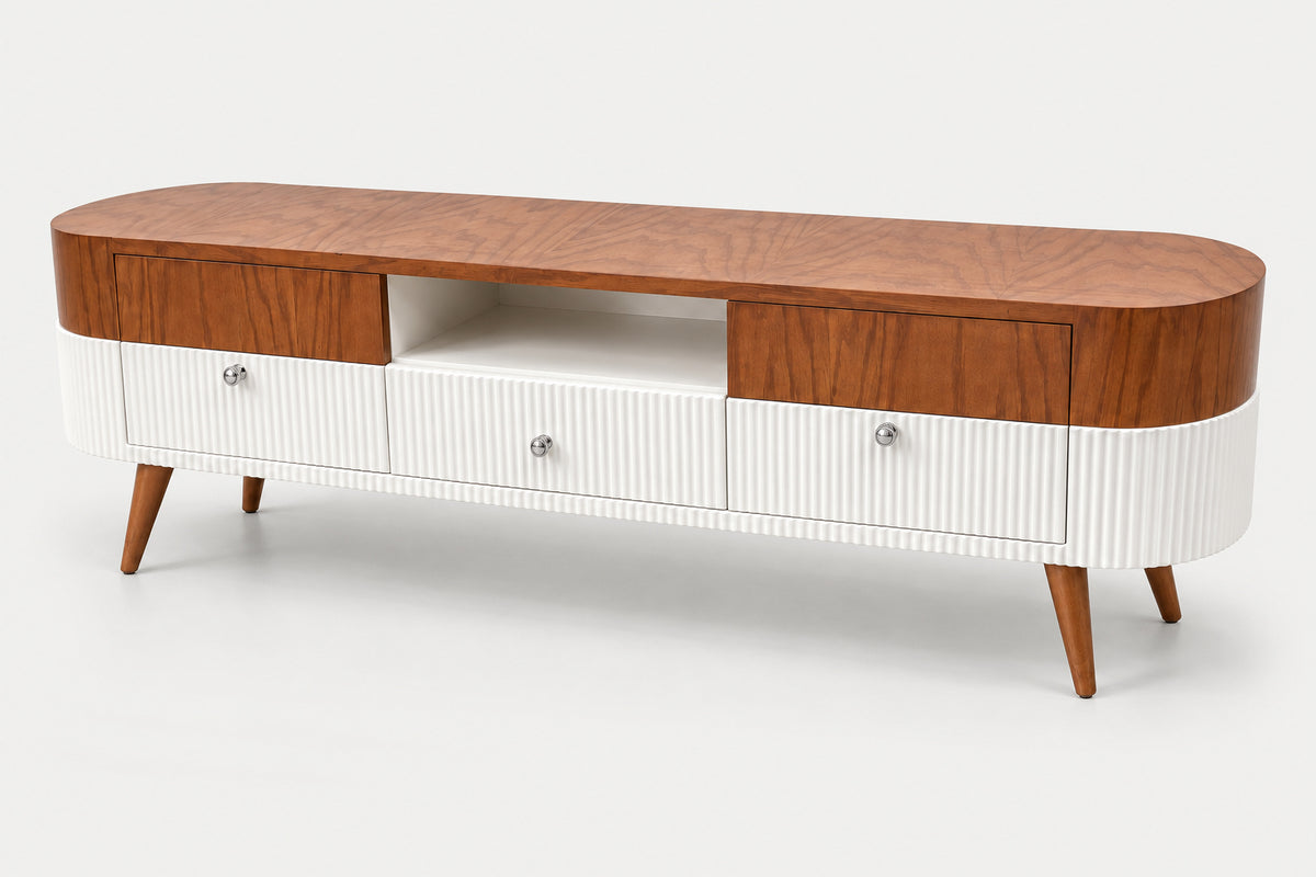 A mid-century modern TV stand or media console with a curved wood top, two upper wood drawers, an open center shelf, ribbed white lower cabinets, and tapered wooden legs, shown on a light gray studio background.
