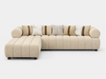 A modern L-shaped sectional sofa upholstered in a textured beige fabric, featuring a chaise lounge on the left, vertical channel tufting on the backrest, and multiple decorative throw pillows in beige, white, and striped patterns, set against a plain light gray background.